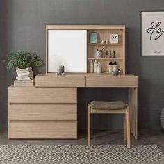 a wooden desk with a mirror, stool and shelf in a gray room next to a plant