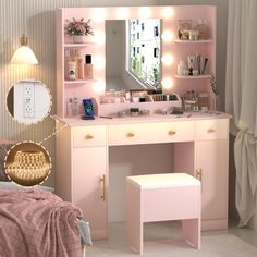 a pink vanity with lights on and a mirror