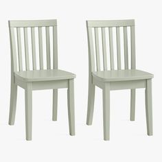 two white chairs sitting next to each other on a white surface with no one in it