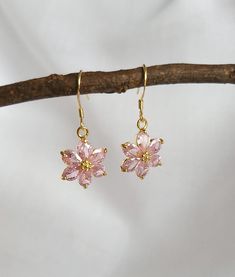 Pink Flower Jewel Hook Earrings, 18k Gold Plated Earrings, Vintage Style Earrings, Victorian Earrings Product specifications: * Material: 18K Gold Plated Brass & Sterling Silver * Size Each charm measures 1.54 cm x 1.38cm. Hook Options: * Tiny Hooks: 18k gold plated brass. 1cm drop. * Sterling Silver Hooks: 18k gold plated sterling silver. 1.4cm drop. Packaging and Gifts: * All pieces of jewellery are sent in a mesh jewellery pouch with a thank you card. Shipping: * All Australian orders will be shipped out within 1 - 3 days by standard untracked letter post. If you require tracking, please upgrade to that option at the time of checkout. I cannot be held responsible for missing orders if you do not upgrade. Delivery within 5 - 6 days. INTERNATIONAL BUYERS please note shipping can sometimes Pink Flower Earrings, Victorian Earrings, Jewellery Pouch, Vintage Style Earrings, Flower Fairy, Chic Jewelry, Earrings Vintage, Gold Plated Earrings, Jewelry Earrings Hoops