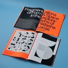 an open book with black and orange designs