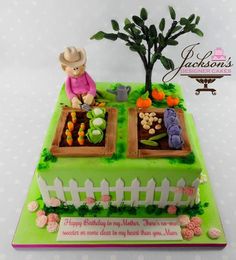 a birthday cake with an image of a tree and vegetable garden on it's side