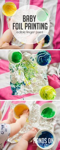 baby painting edible finger paint in three different bowls on a pink and white striped blanket