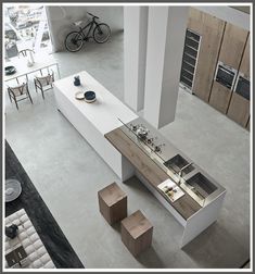 an overhead view of a modern kitchen and living room