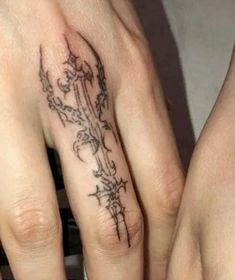 two people with matching tattoos on their fingers