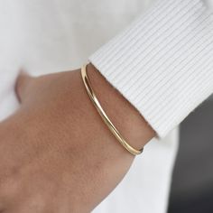 "14K solid gold cuff bracelet The bracelet will be shipped in a gift box * 14K solid gold. It is about 3.25mm width. Please select the size of your wrist.  If your wrist is 6\", please purchase a 6.25\" or 6.5\"bracelet. (If you order a 6\" bracelet, actual cuff length will be 5\" plus 1 inch opening.)" Luxury Adjustable Minimalist Cuff Bracelet, Gold Cuff Bracelet With Polished Finish For Everyday Luxury, Timeless Gold Cuff Bracelet For Everyday Wear, Everyday Gold Timeless Cuff Bracelet, Timeless Yellow Gold Cuff Bracelet For Everyday, Everyday Luxury Polished Cuff Bracelet, 14k Gold Bangle With Polished Finish For Everyday Luxury, Classic Everyday Bangle, Tarnish Resistant, Classic Gold Open Cuff Bracelet