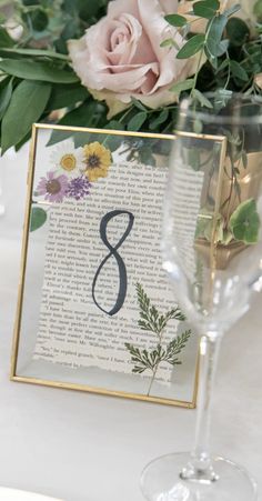 Wedding table numbers in a gold floating clasp frame with a Jane Austen book page & dried flowers pressed inside. Pressed Flower Table Numbers, Pressed Flower Table, Bookish Wedding, Flower Table Numbers, Flower Table, Whimsical Wedding