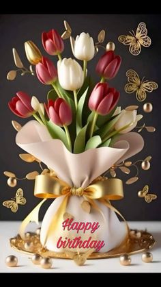 a bouquet of tulips with the words happy birthday written on it and butterflies flying around