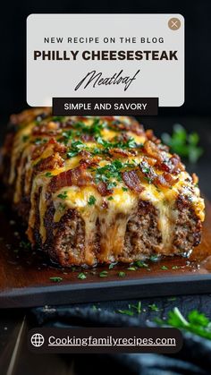 a cheesy meatloaf on a wooden cutting board with the title text overlay reads new recipe on the blog phil