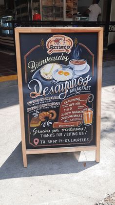 a sign for a restaurant on the sidewalk