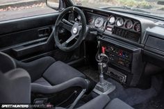 the interior of a car with dashboard and steering wheel