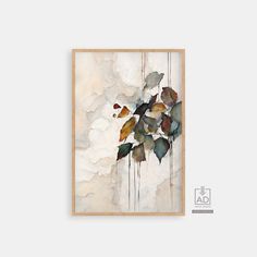 a painting with leaves on it in a wooden frame