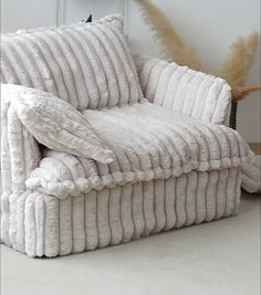 a chair made out of blankets sitting on the floor