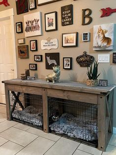 a dog kennel with some pictures on the wall above it and other things around it