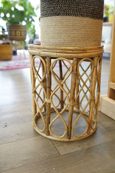 a wicker basket sitting on top of a wooden floor