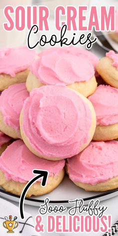 pink frosted cookies on a plate with the words sour cream cookies so fluffy and delicious