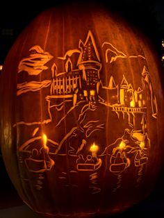 a carved pumpkin with an image of a castle on it