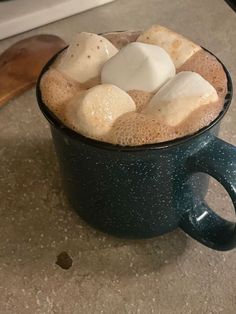 hot chocolate with marshmallows in a blue mug