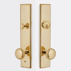 two golden door handles with knobs on each side and one has a round handle