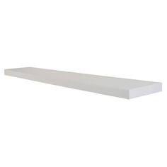 a white shelf sitting on top of a wall