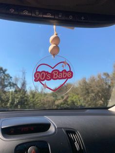 the inside of a car with a sticker that says 90's babe on it