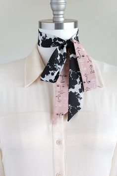 "Black, white, and pink neck scarf in a shadow bouquet/face print mix. Ready to ship, special edition midi-length skinny scarf designed by Cinne. Full of character with endless styling possibilities. Wear around your neck, in your hair, tied on your favorite bag, or around your wrist. Find more styling examples in second to last photo. Constructed entirely by hand with love and attention to every detail. . . . . . . . . . . . . . . . . . . . . . . . . . . . . . . . . . . . . . . . . . . . . . . Chic Scarves With Ties, Chic Adjustable Scarves With Ties, Trendy Scarves With Ties For Spring, Trendy Spring Scarves With Ties, Trendy Black Scarf As Gift, Black Silk Scarf As Summer Gift, Chic Scarves With Ties For Spring, Black Silk Scarf For Summer Gift, Chic Spring Scarves With Ties