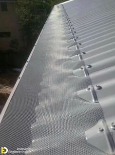 an image of a metal roof that is being installed on the side of a building