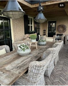 an outdoor dining area with wicker furniture