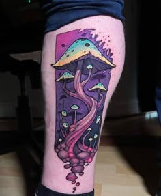 a colorful tattoo on the leg of a person with mushrooms and watercolors in it