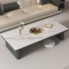 a white marble coffee table in a living room