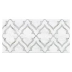 a white marble tile with an intricate design