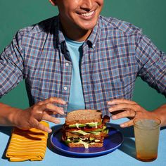 a man sitting at a table with a plate of food