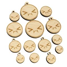 wooden charms with different designs on them