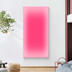 a living room with a couch, chair and large pink painting on the wall above it