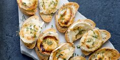 small appetizers with cheese and herbs are on a paper towel, ready to be eaten