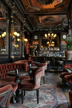 an ornately decorated bar with red velvet chairs