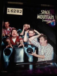 an old photo of some people in a roller coaster at the space mountain amusement park