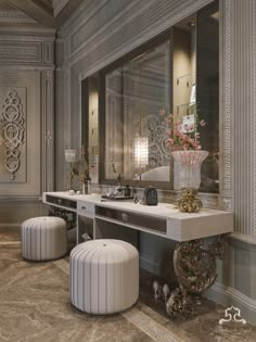 a bathroom with two sinks and stools in front of a mirror on the wall