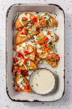 a pan filled with chicken and ranch dressing