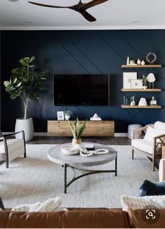 a living room filled with furniture and a flat screen tv