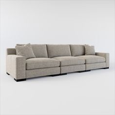 a beige couch with pillows on it and white wall in the background, 3d rendering