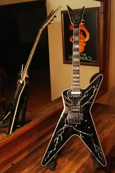 an electric guitar sitting on top of a wooden table