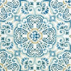 a blue and white tile with an ornate design