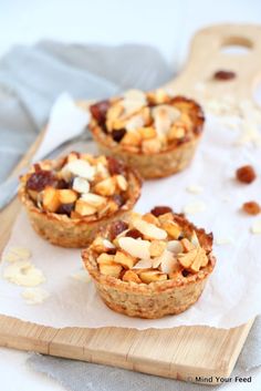 three mini pies sitting on top of a cutting board