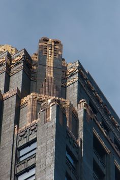 the top of a tall building with a clock on it's face