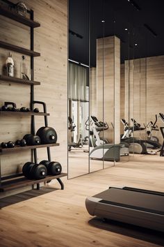 an exercise room with mirrors and treadmills in the foreground, on wooden flooring