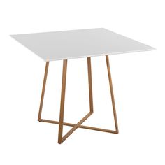 a white square table with gold legs on a white background in front of a white backdrop