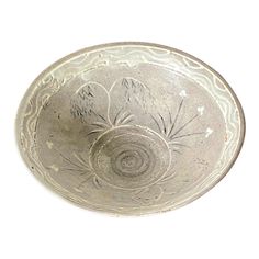 an old silver bowl on a white background