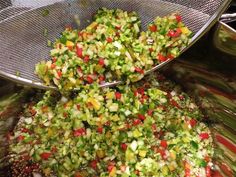 two metal strainers filled with chopped vegetables