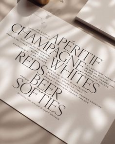 an advertisement for champagne white's red - beer softies is displayed on a table